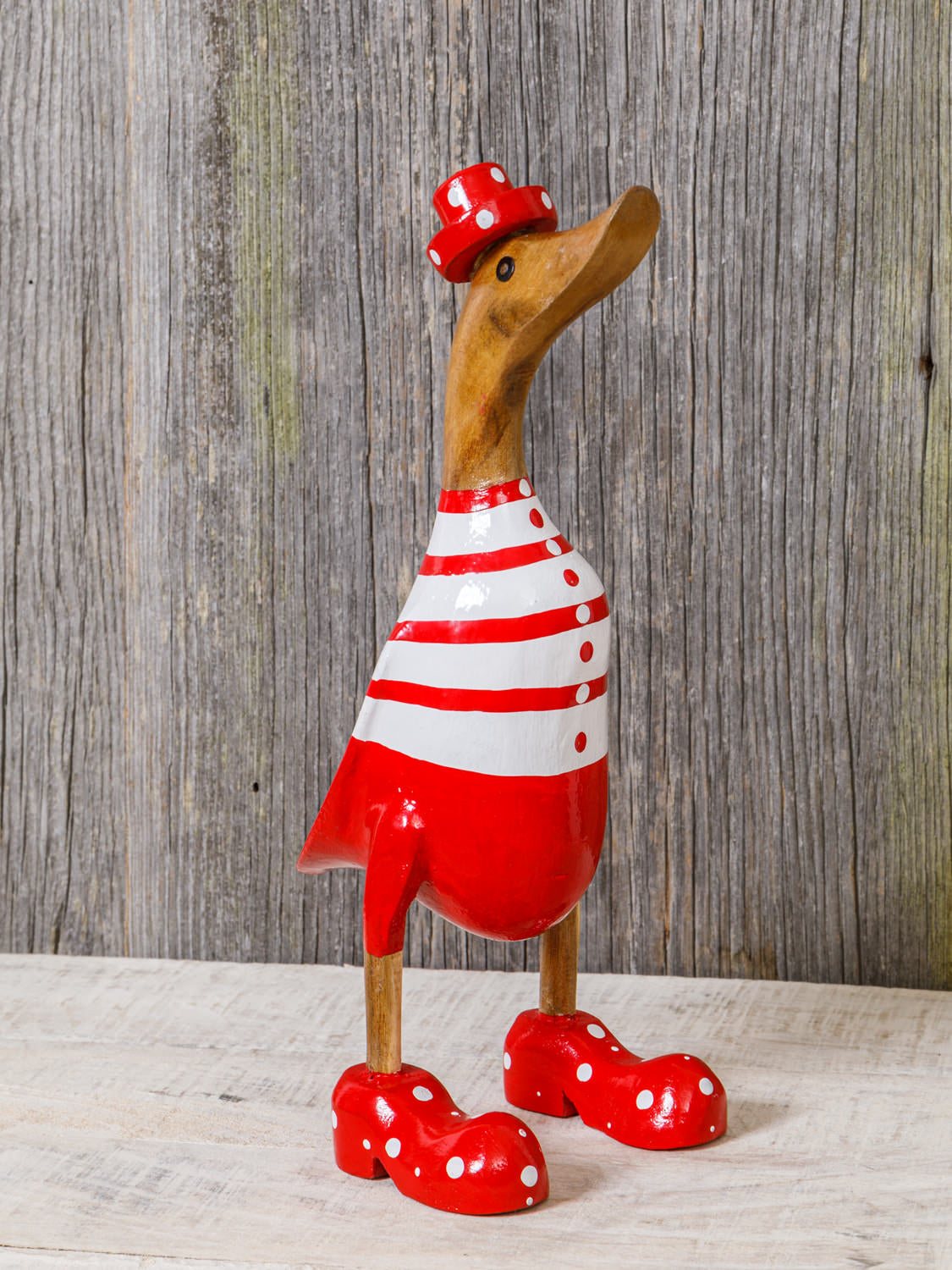 Ente aus Holz rot geringelter Badeanzug