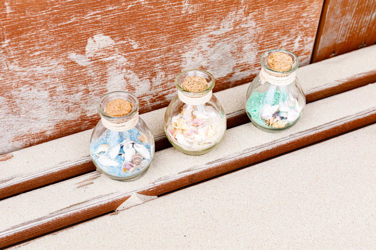 Flasche Sand Muscheln rund